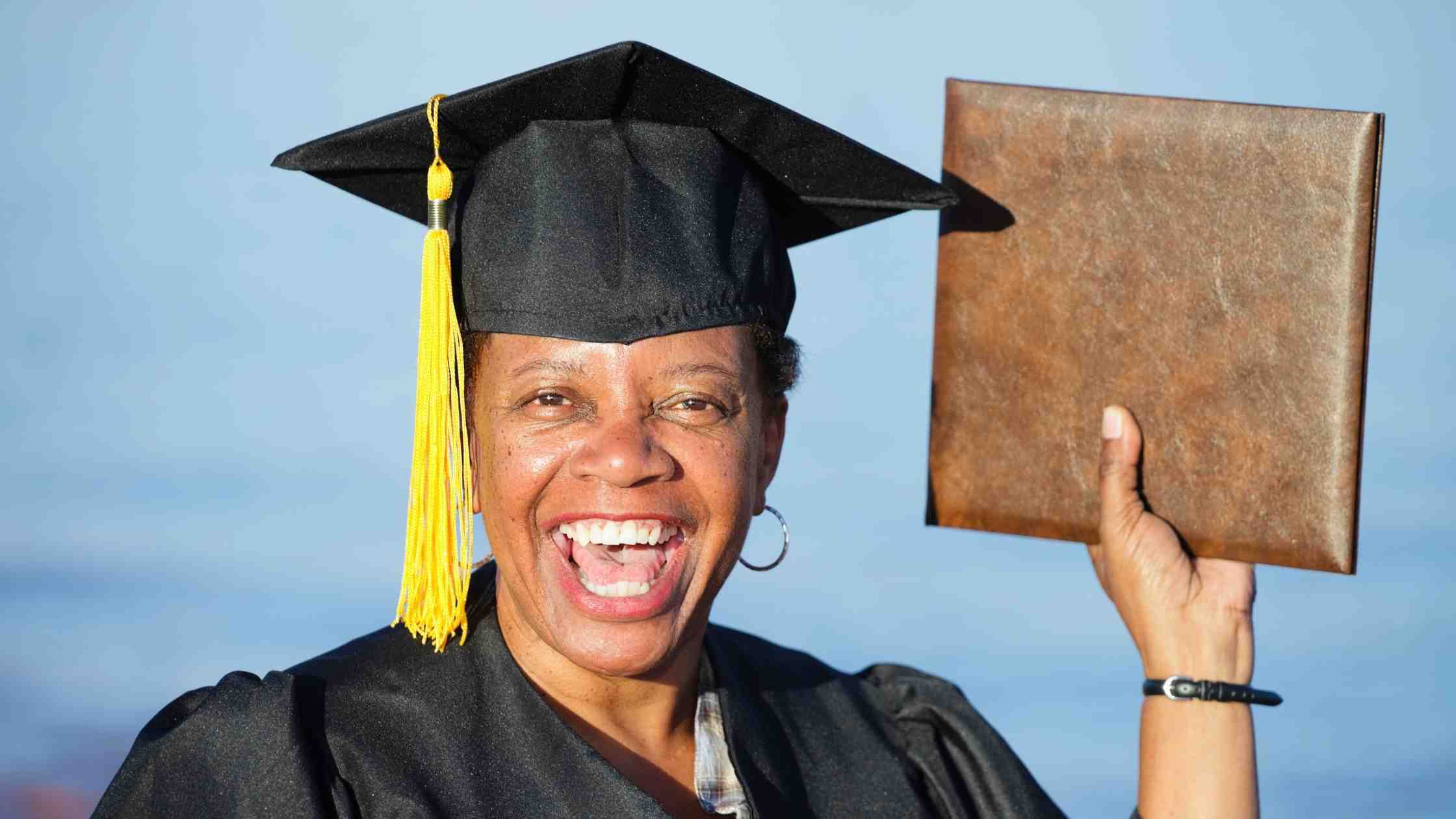 woman happy with diploma